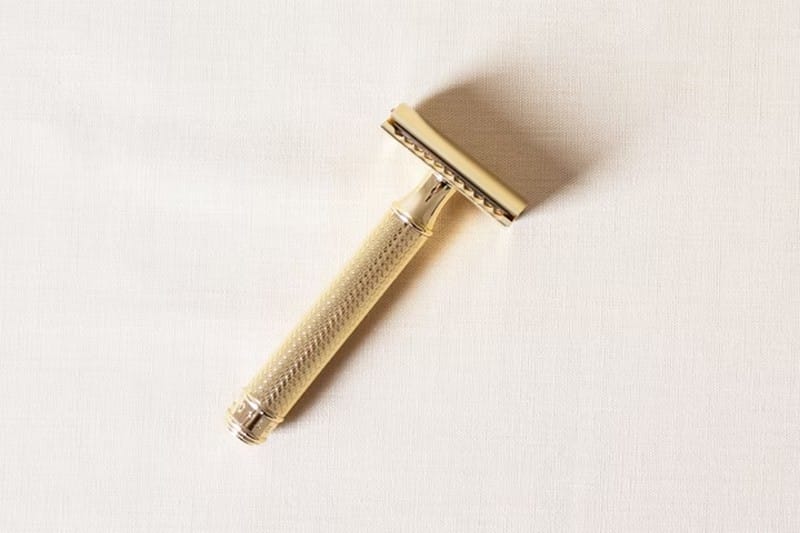 Rinse the razor with hot water