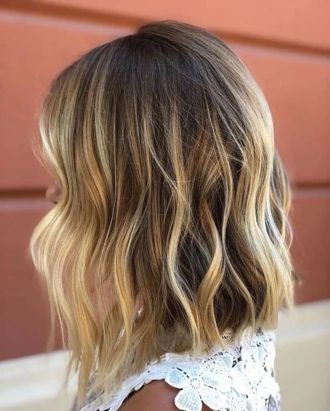 honey-balayage-on-mid-length-shiny-hair-with-big-bangs-3965836-5771435