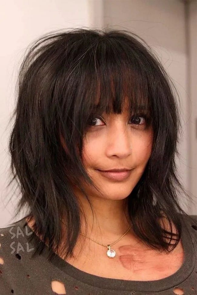 mid-length-brown-tousled-layered-hair-cut-with-bulging-fringe-9022137-5141654