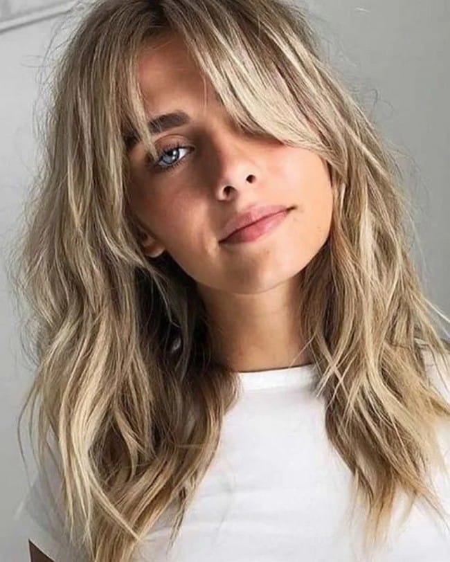 mid-length-layered-haircut-honey-blonde-tapered-with-swept-side-parting-9061114-4258207